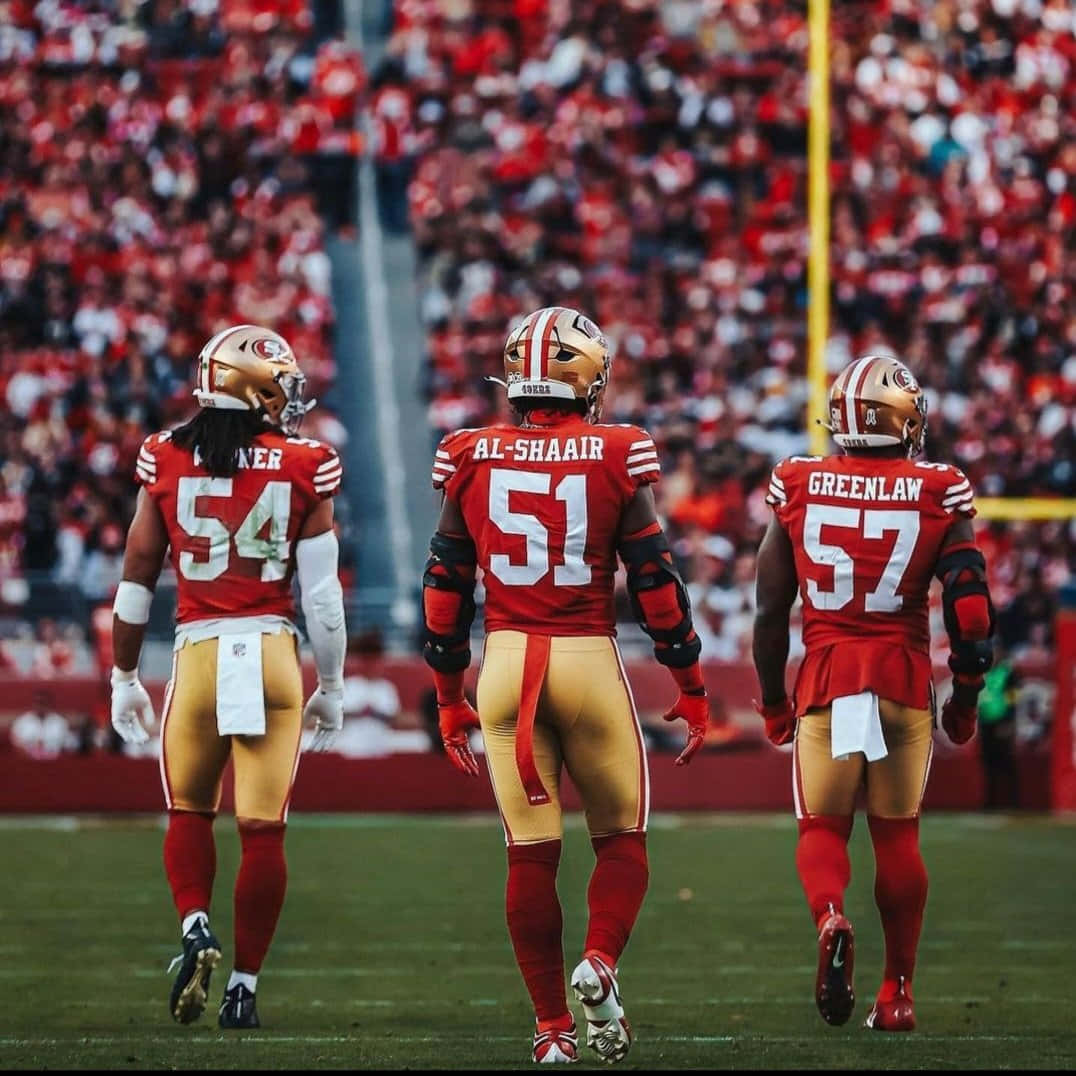 49ers Linebackers Walkingon Field Wallpaper