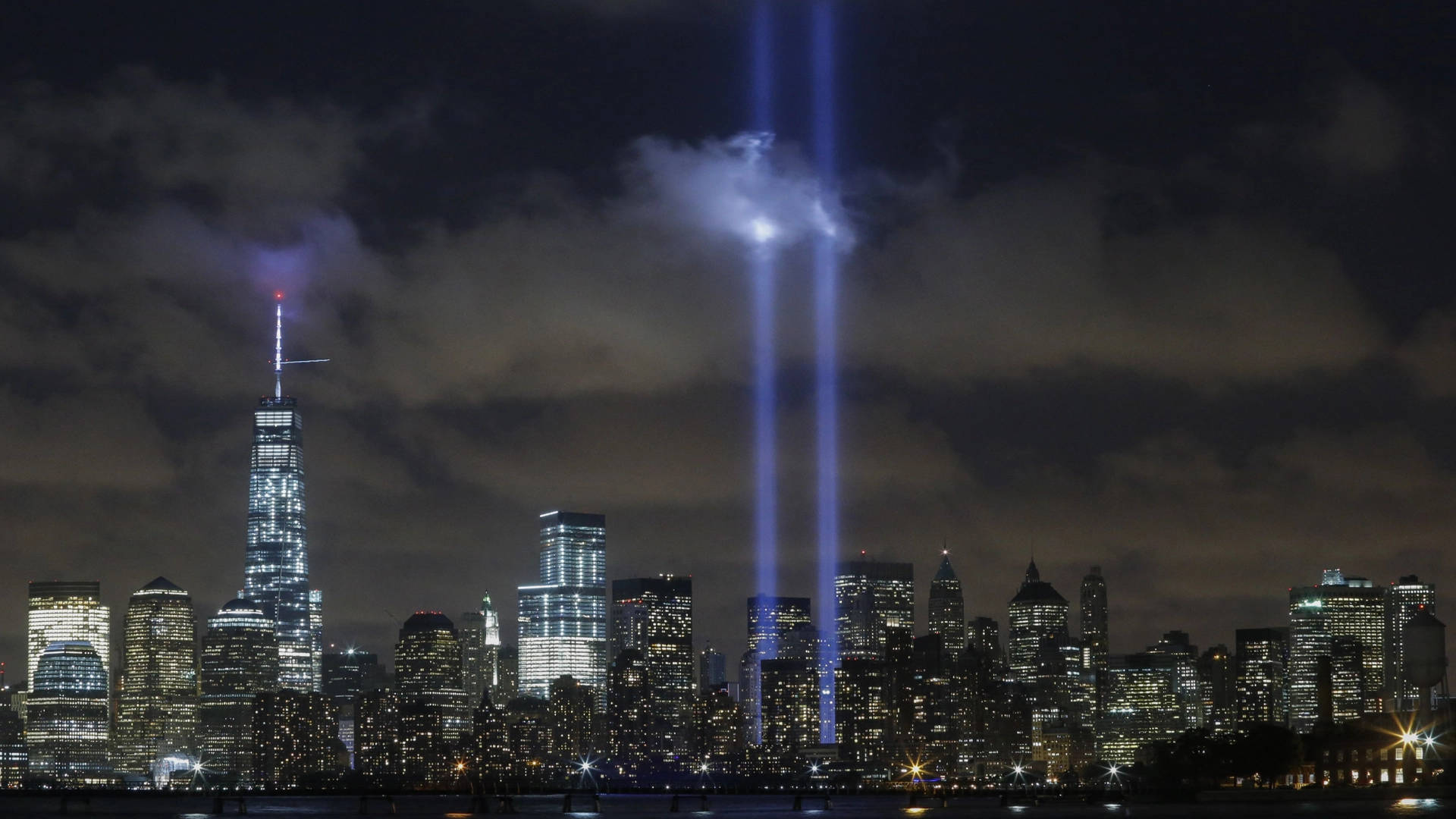 911 Memorial Tribute In Cloudy Sky Wallpaper