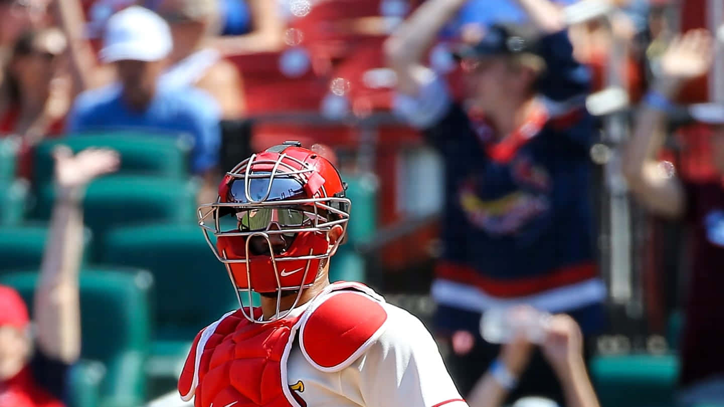 A Baseball Player Is Standing In Front Of A Crowd Wallpaper