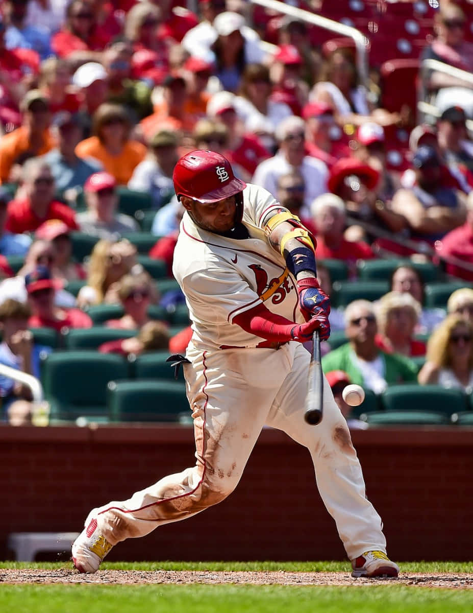 A Baseball Player Swinging A Bat Wallpaper