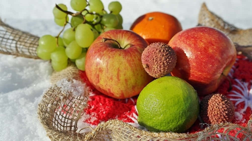 A Beautiful Assortment Of Winter Fruits Wallpaper