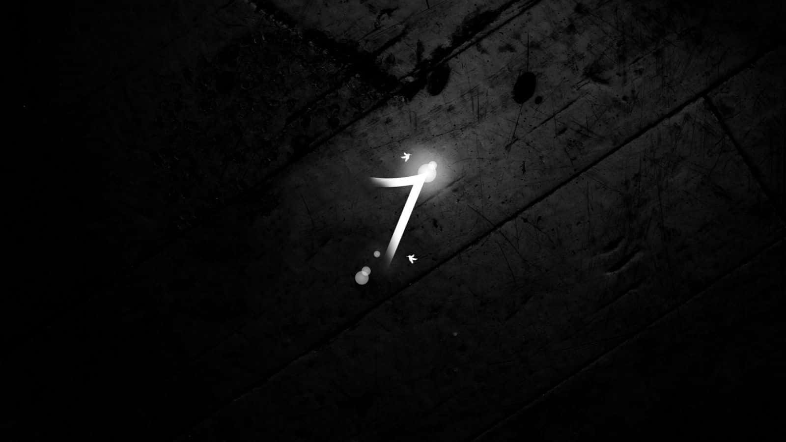 A Black And White Image Of A Number On A Wooden Floor Wallpaper