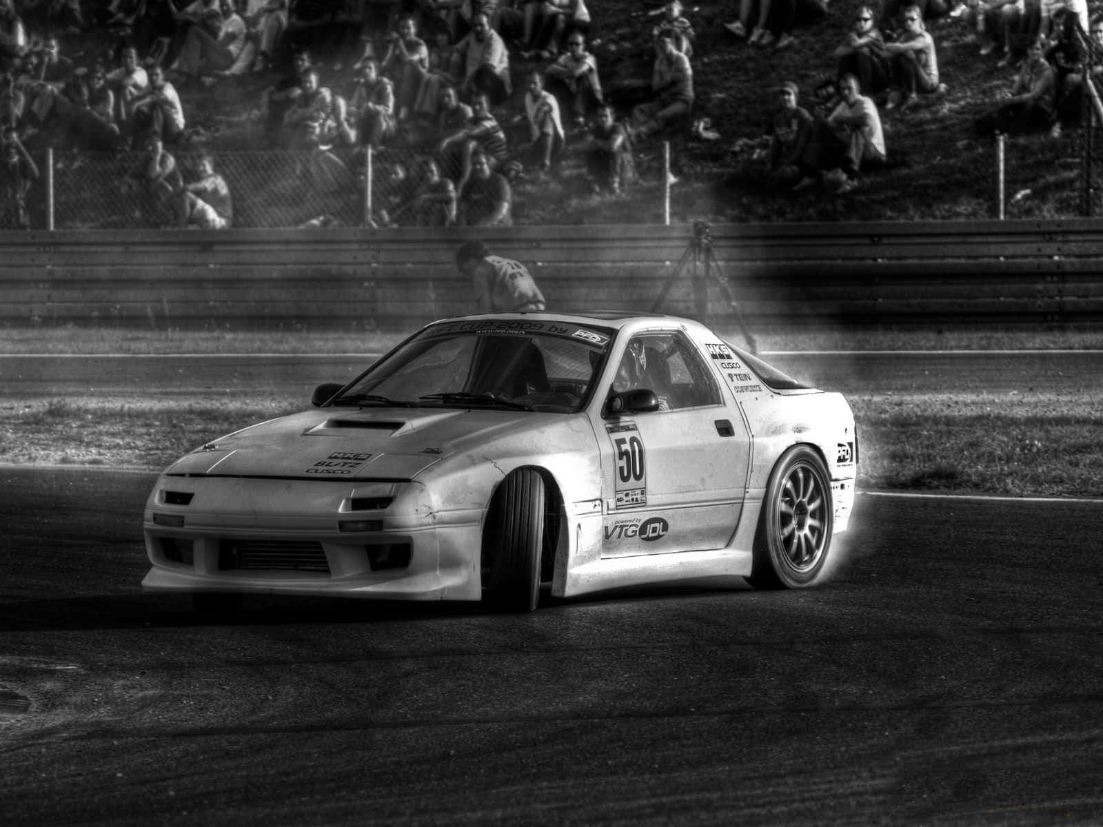 A Black And White Photo Of A Drift Car Wallpaper