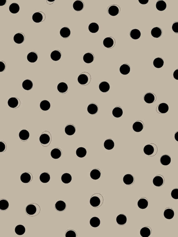 A Black And White Polka Dot Pattern On A Beige Background Wallpaper