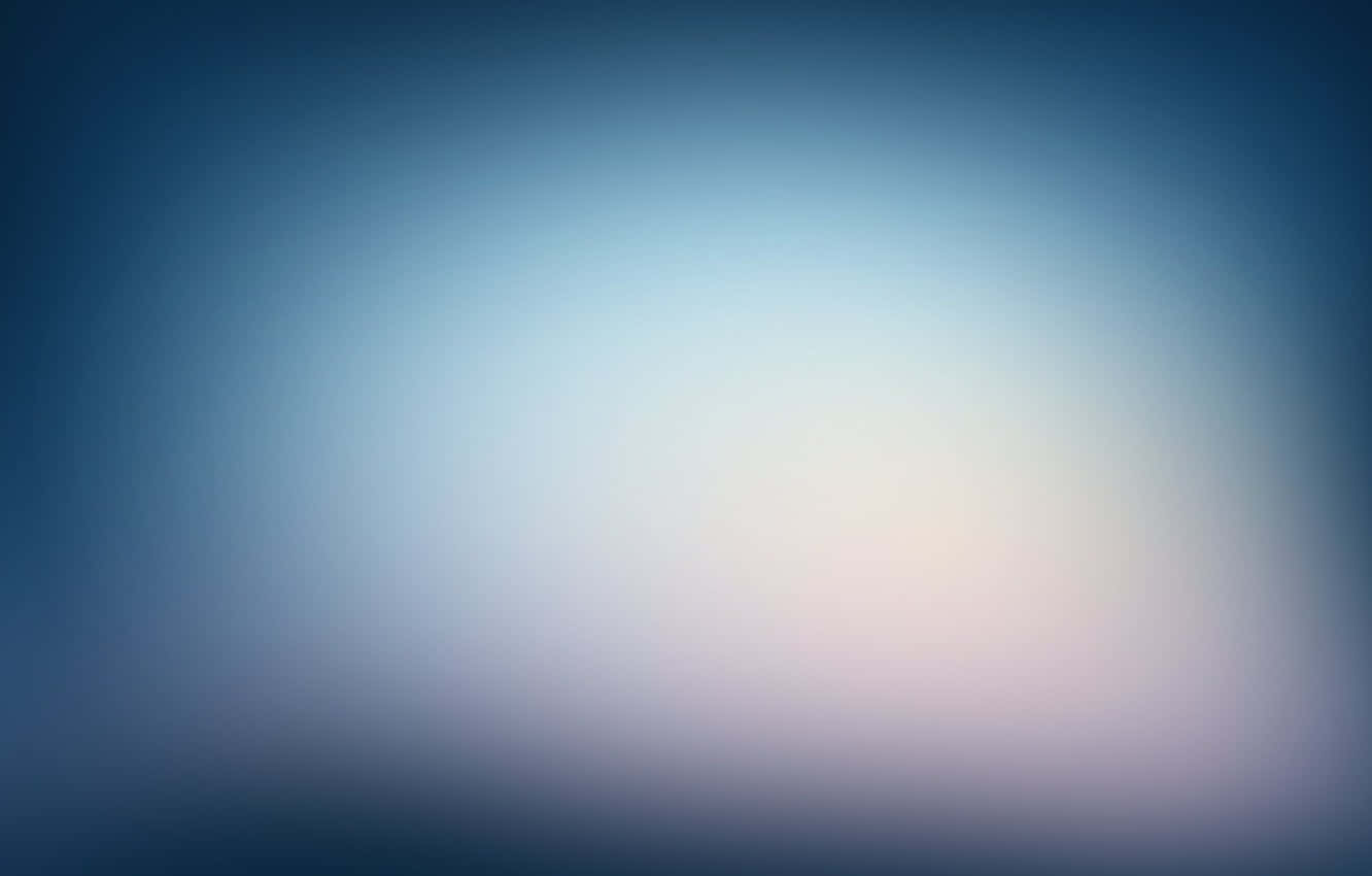 A Blurred Blue Background With A Light Blue Sky Wallpaper