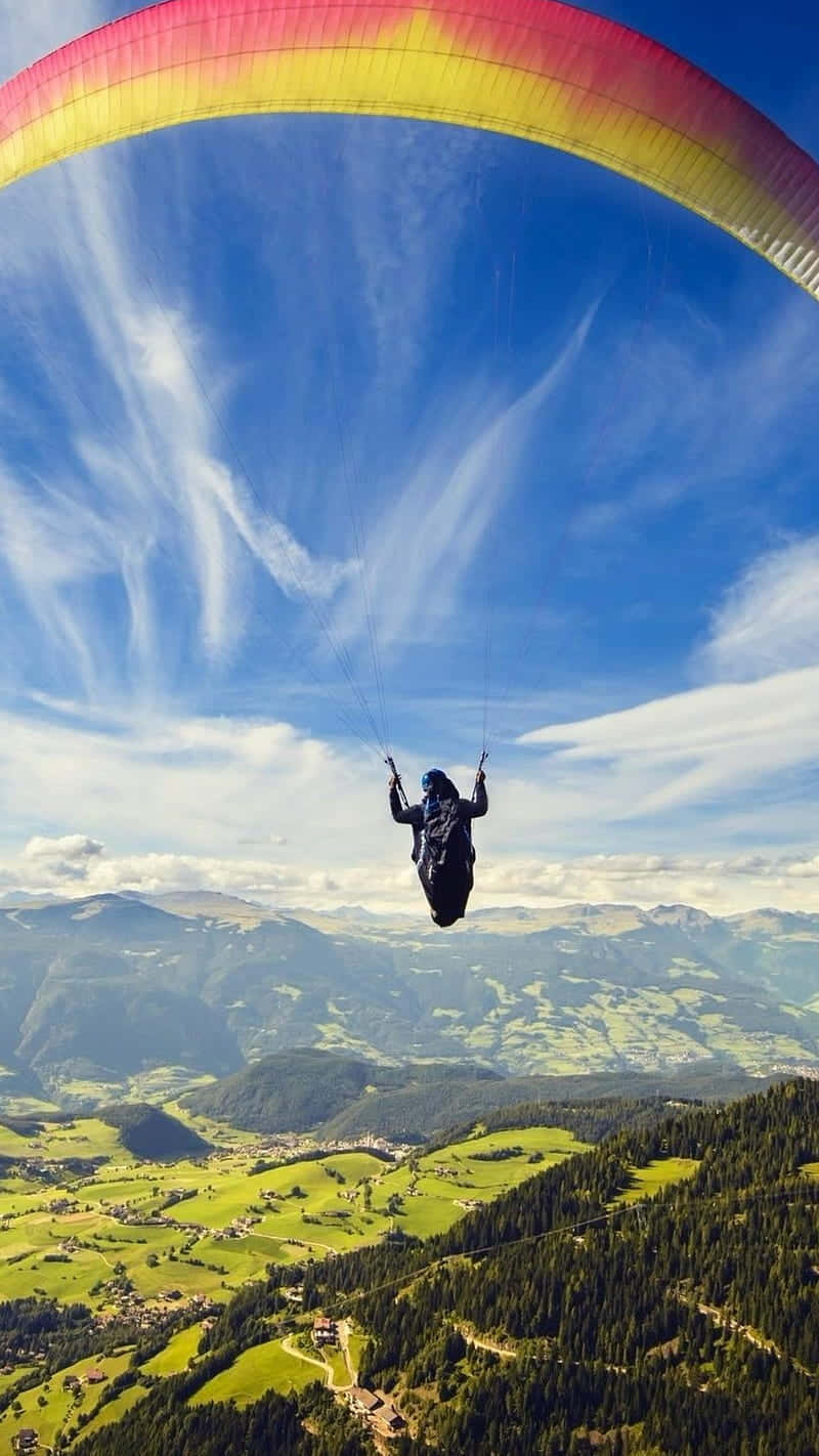 A Breathtaking Paragliding Adventure Wallpaper