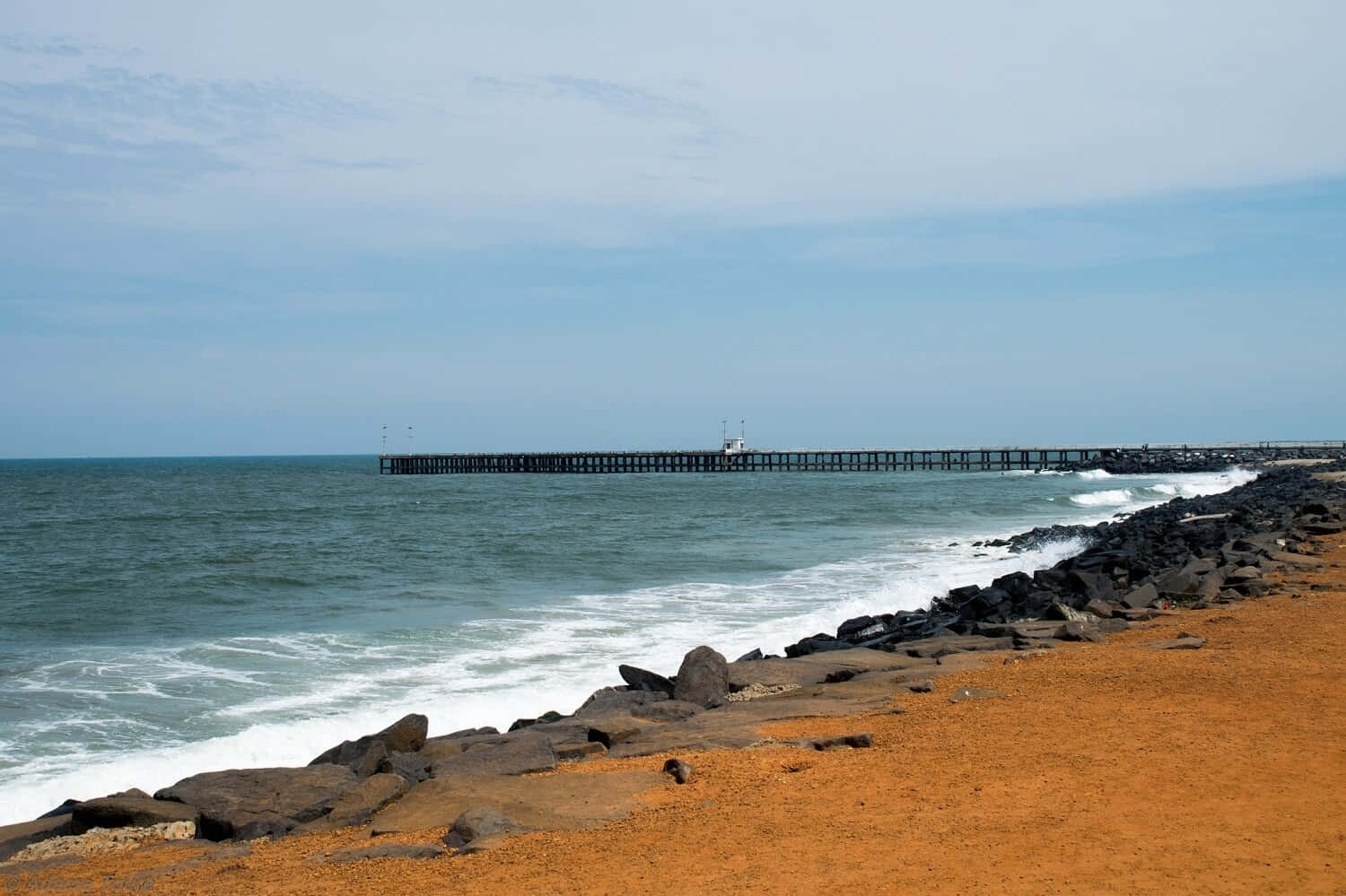 A Breathtaking View Of The Serene French Beach Wallpaper