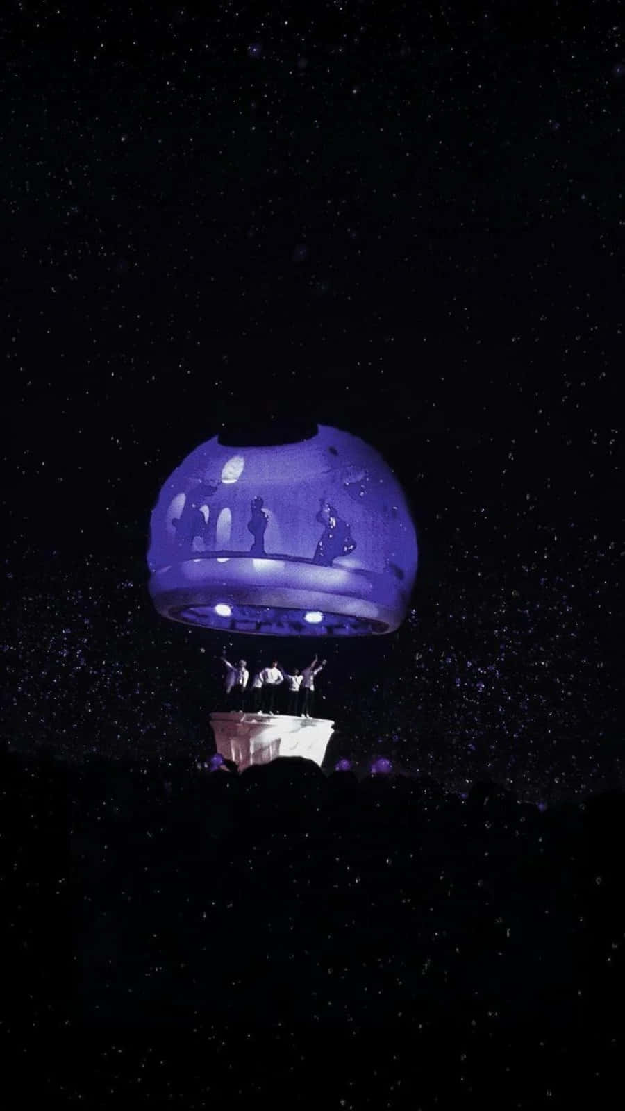 A Bts Army Bomb Illuminating The Night Sky At A Concert Wallpaper