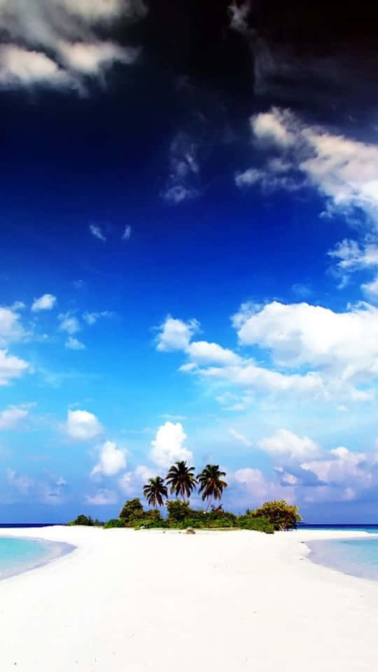 A Calming Scene Of A Lake Reflecting A Blue Sky Wallpaper