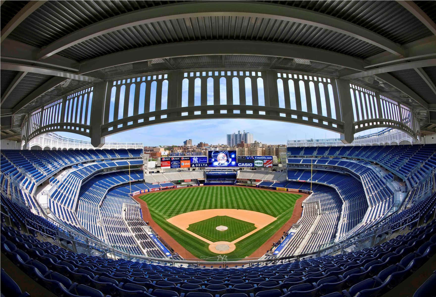 A Captivating Baseball Stadium At Night Wallpaper