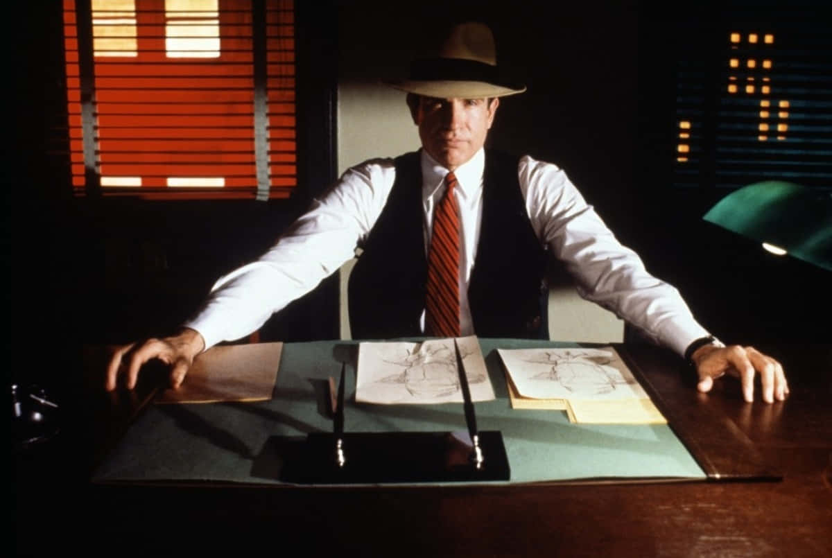 A Charismatic Warren Beatty Posing During A Photoshoot Wallpaper