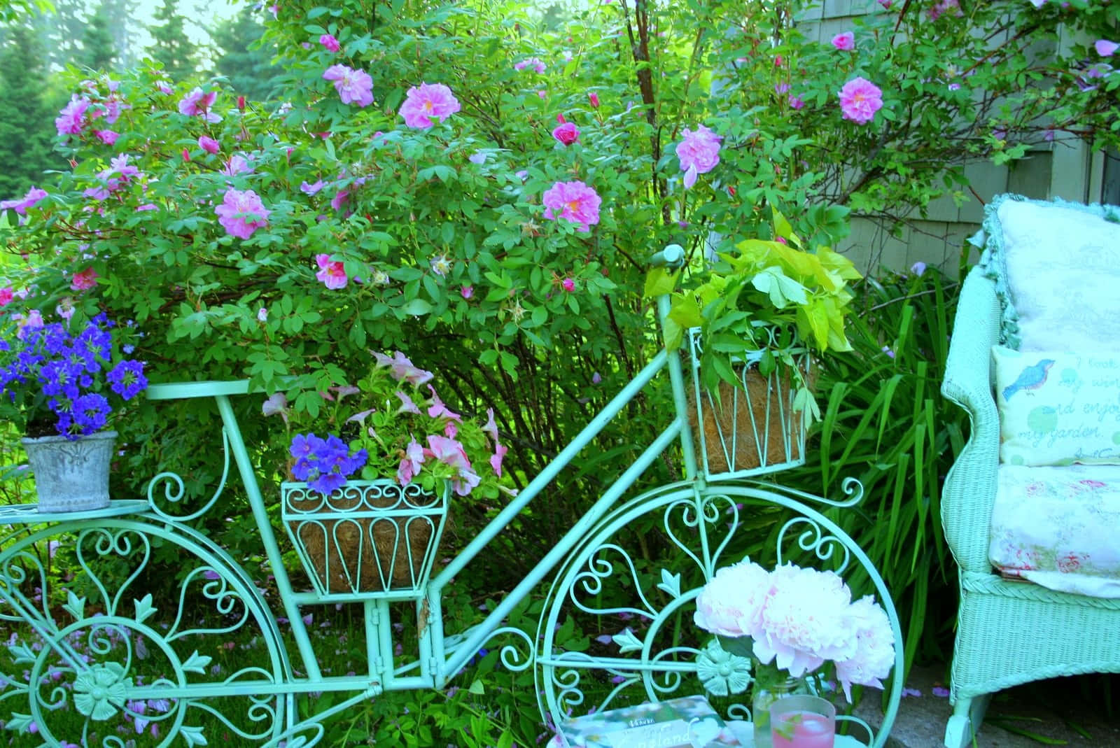 A Charming Flower Cart Filled With A Colorful Array Of Blooming Flowers Wallpaper