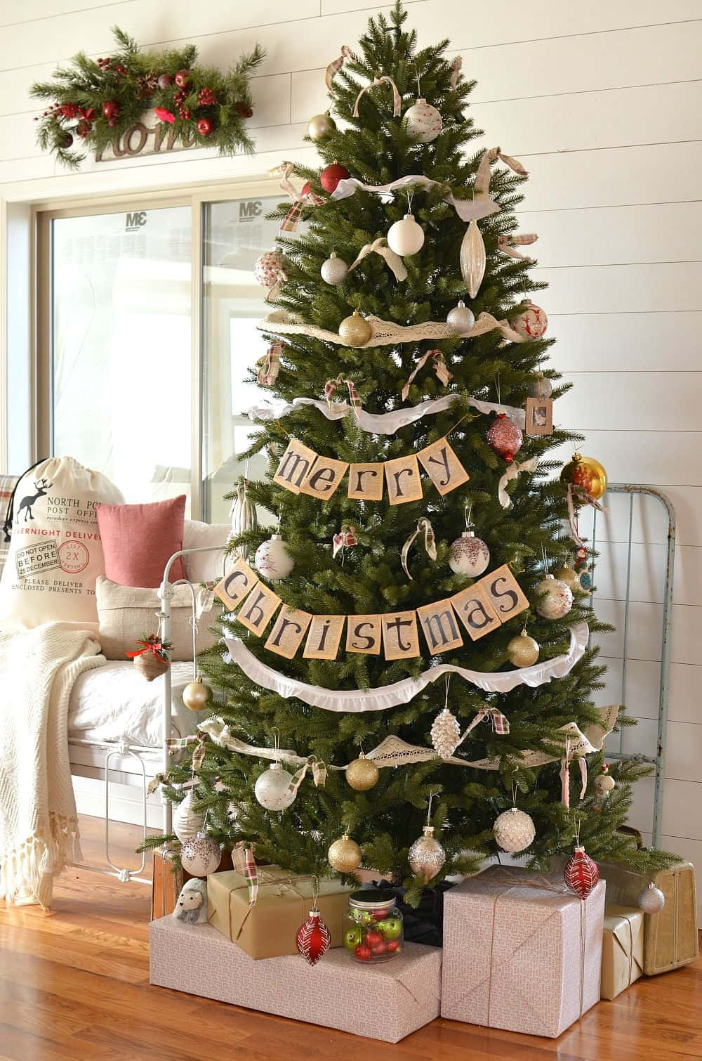 A Christmas Tree In A Living Room With Gifts Wallpaper