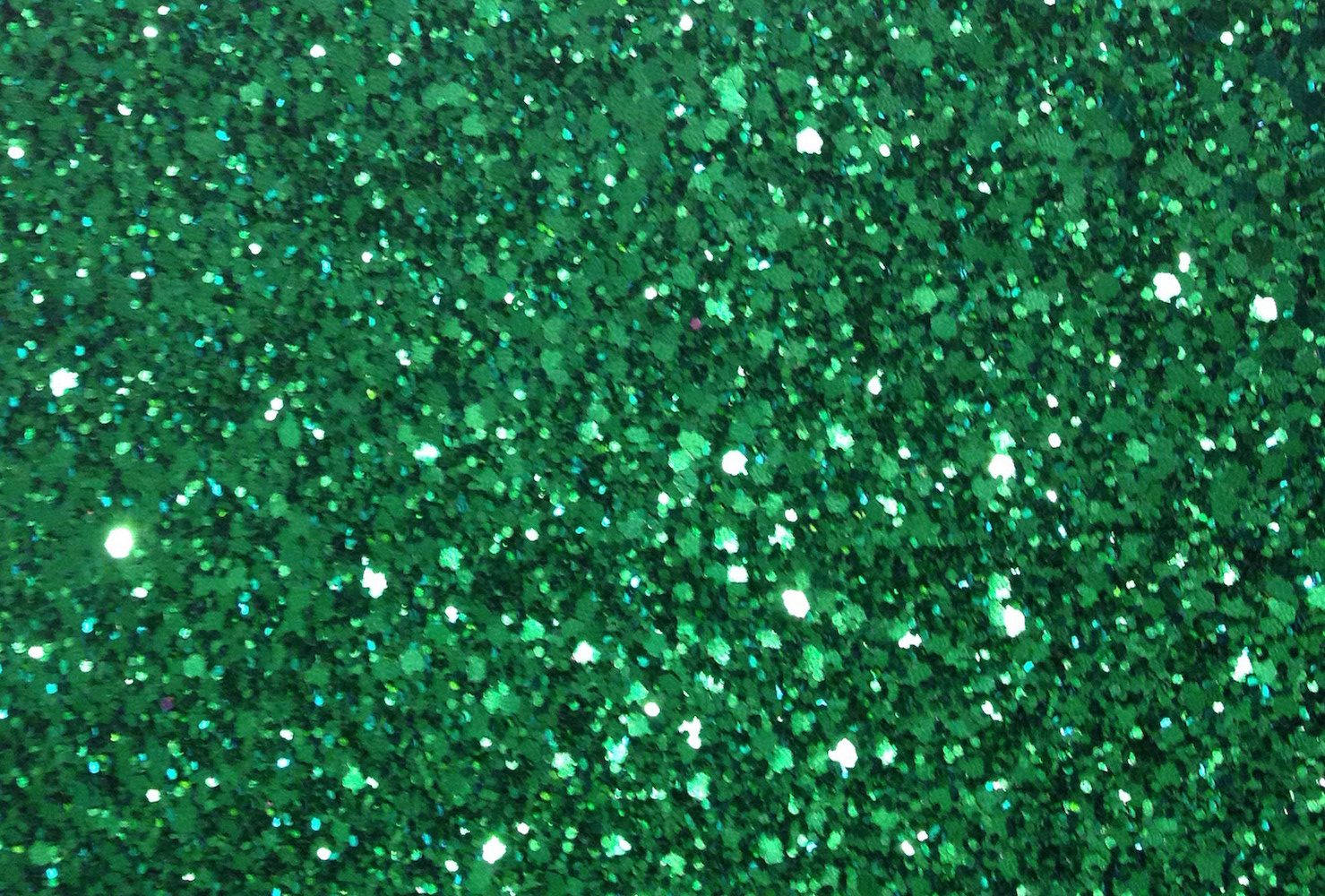 A Close Up Of A Green Glitter Wallpaper