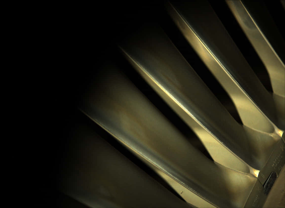 A Close Up Of A Metal Fan Wallpaper