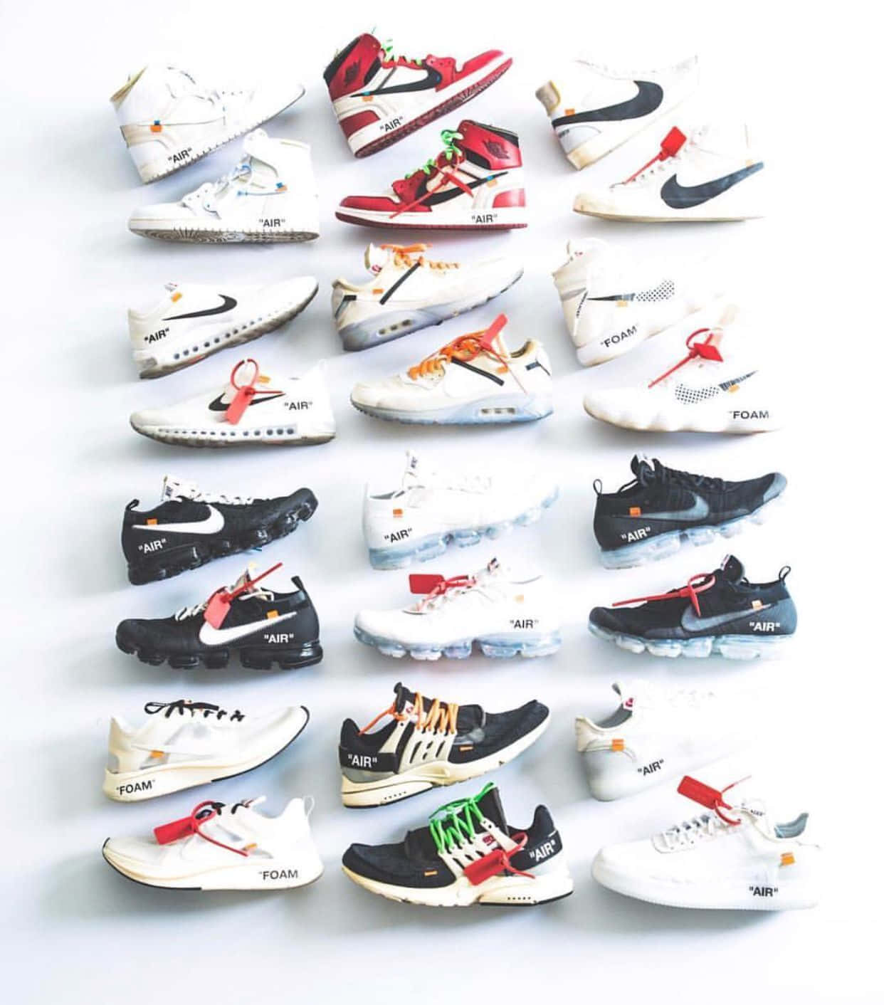 A Collection Of Nike Air Max Sneakers Are Arranged On A White Surface Wallpaper