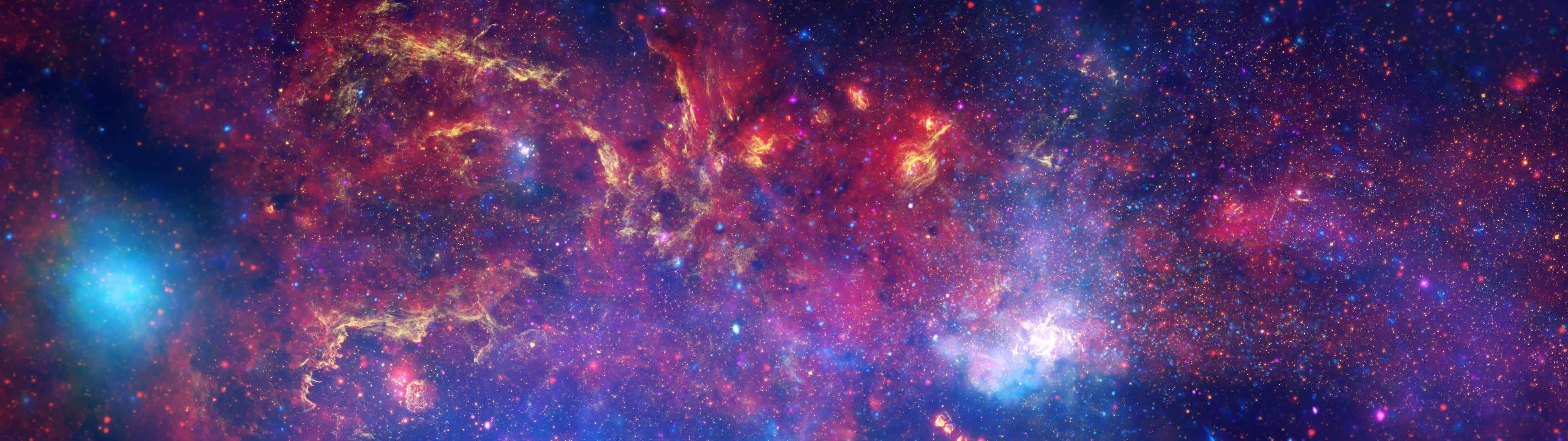 A Colorful Space With Stars And Nebulas Wallpaper