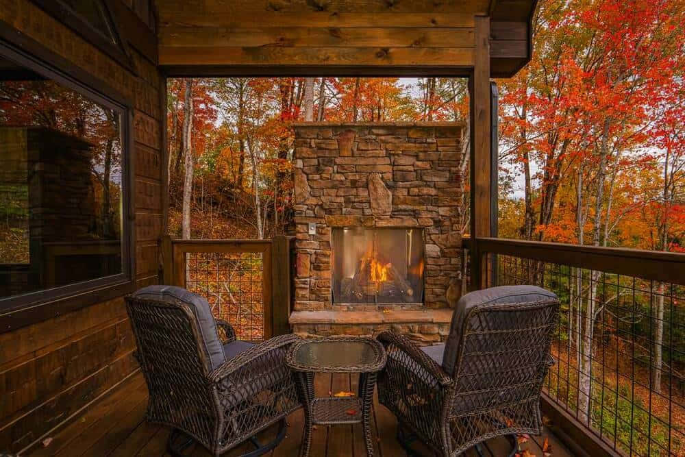 A Cozy Fall Cabin Surrounded By Vibrant Autumn Foliage. Wallpaper