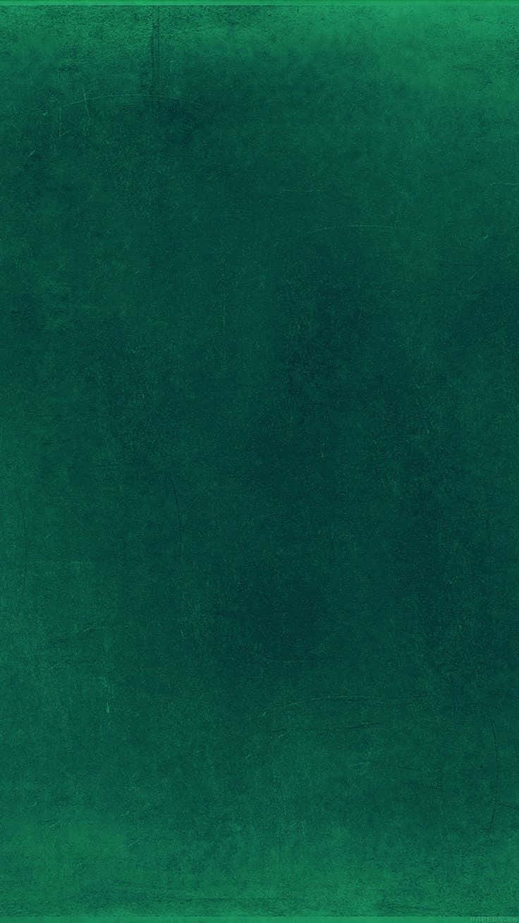 A Dark, Distressed Green Wall With A Unique Grungy Texture Wallpaper