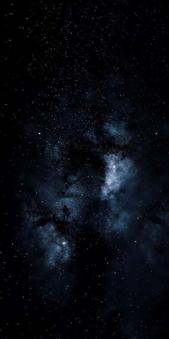 A Dark Space With Stars And Clouds Wallpaper