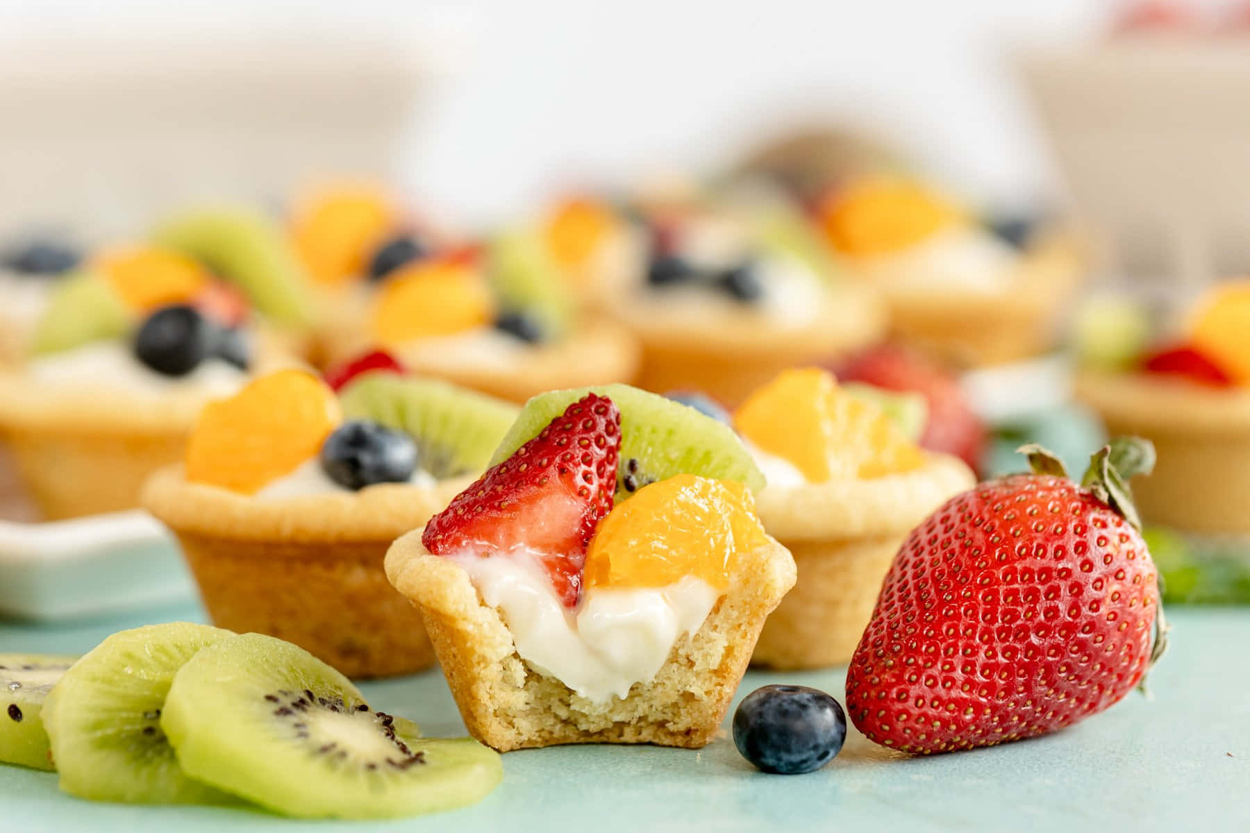 A Delectable Fruit Tarte On A White Plate Wallpaper