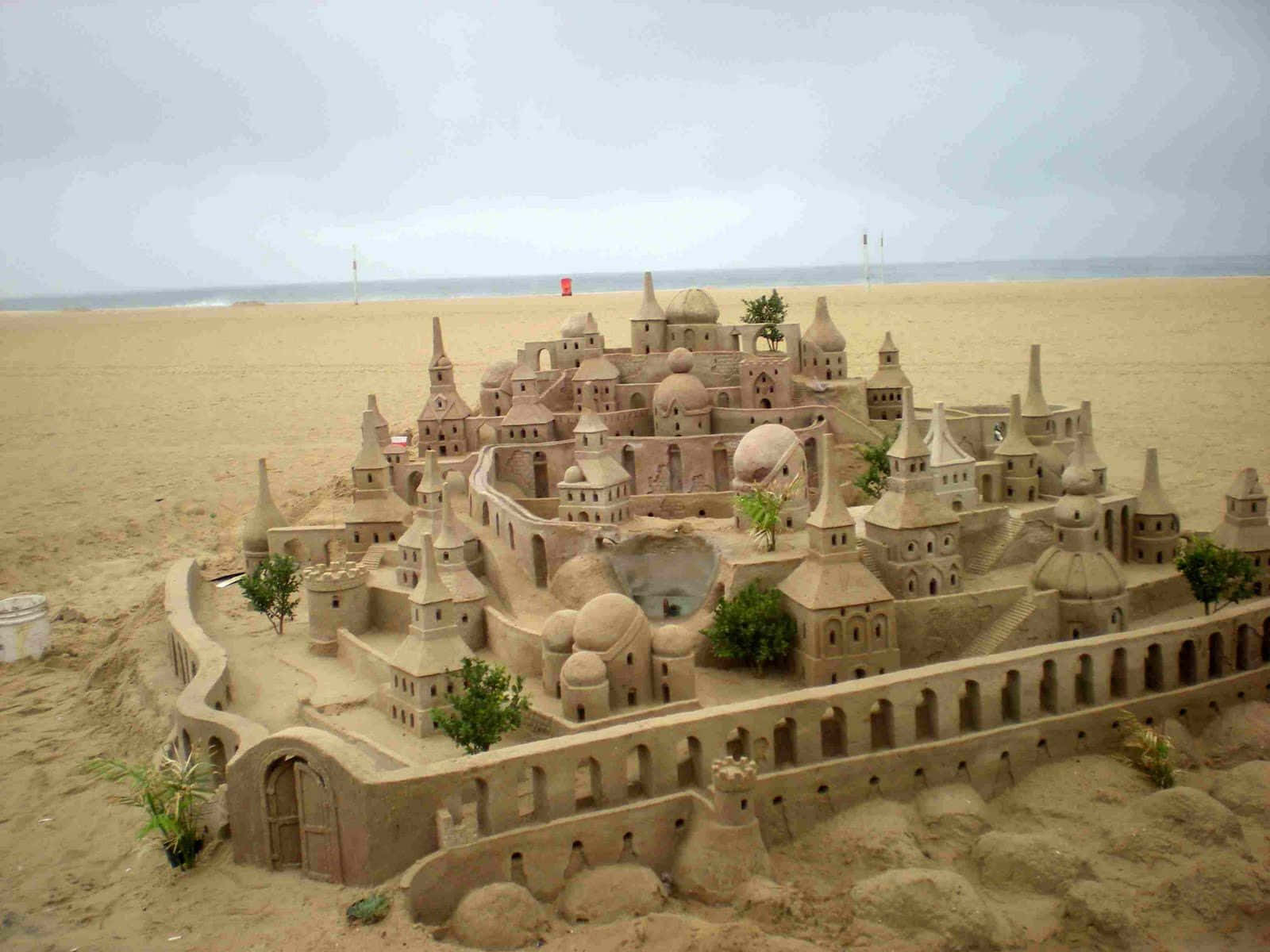 A Dreamy Beach Day With Magical Sandcastles Wallpaper