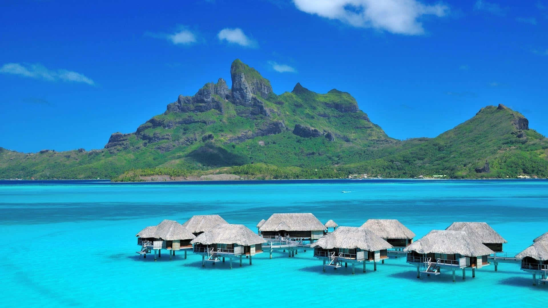 A Dreamy Sunrise In Bora Bora Wallpaper