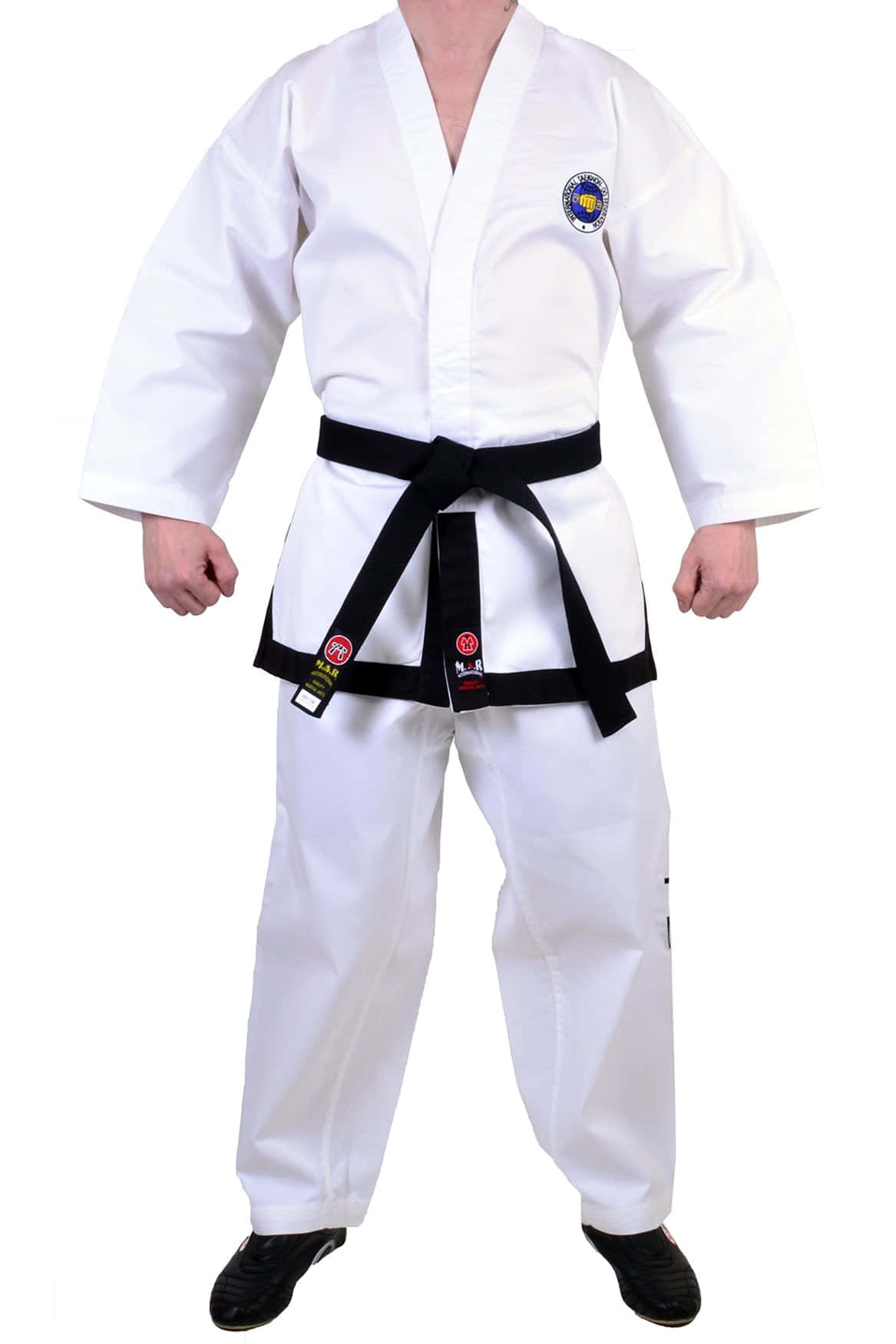 A Focused Student In Taekwondo Uniform Prepares To Throw A Kick Wallpaper