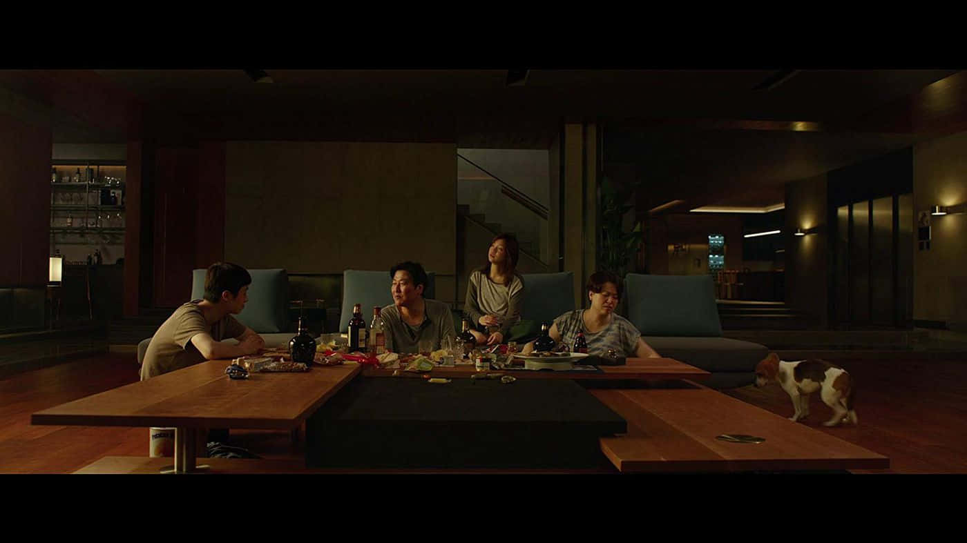 A Gripping Scene From The Oscar-winning Movie Parasite Wallpaper