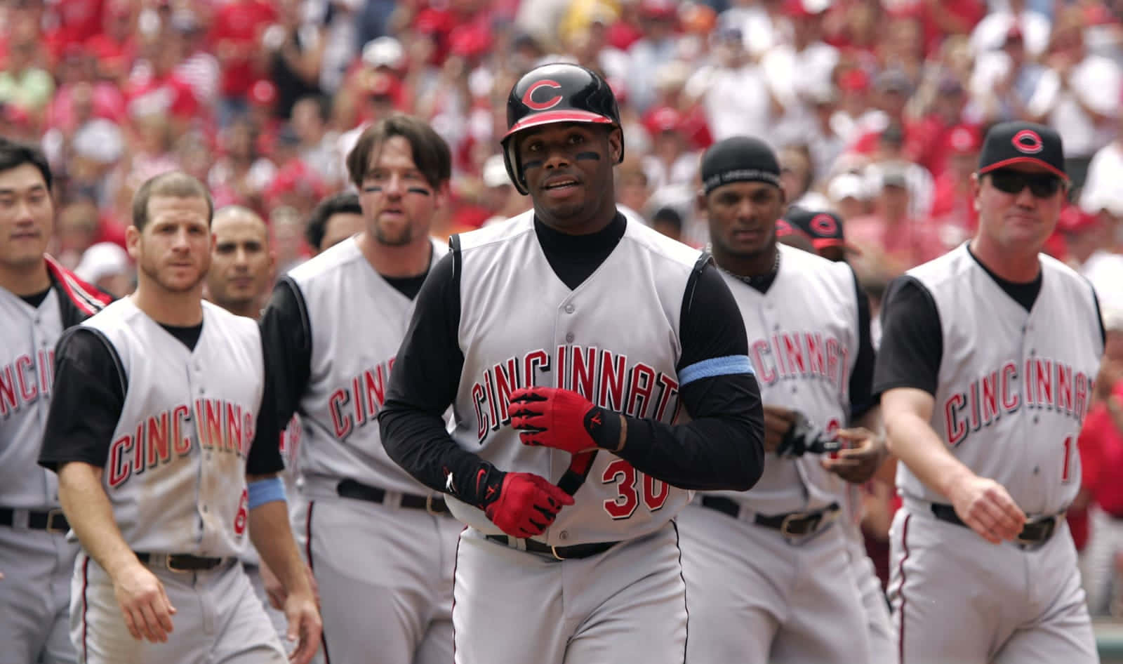 A Group Of Baseball Players Walking On A Field Wallpaper