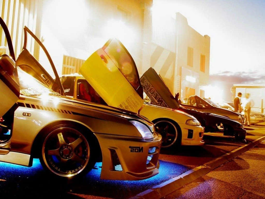 A Group Of Cars Parked In A Parking Lot Wallpaper