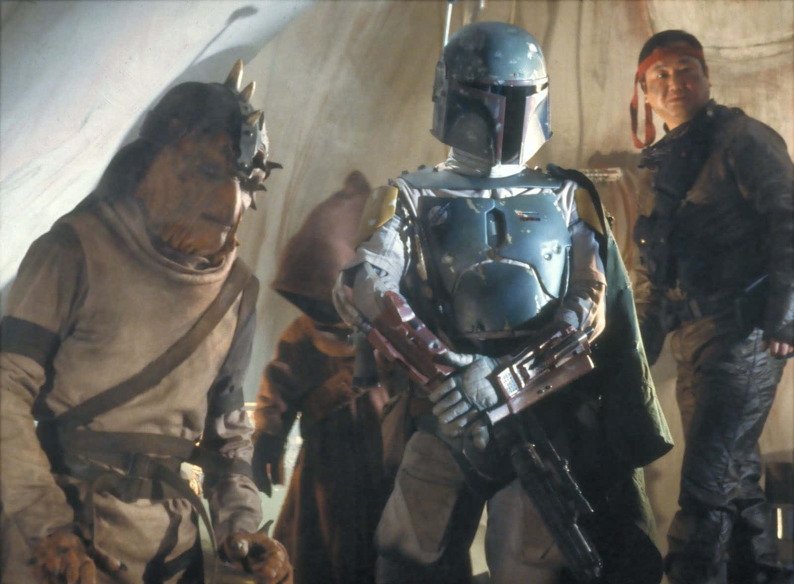 A Group Of Fierce Bounty Hunters Ready For Action Wallpaper