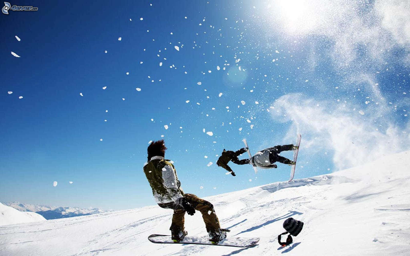 A Group Of Friends Skiing On A Snowy Mountain Wallpaper