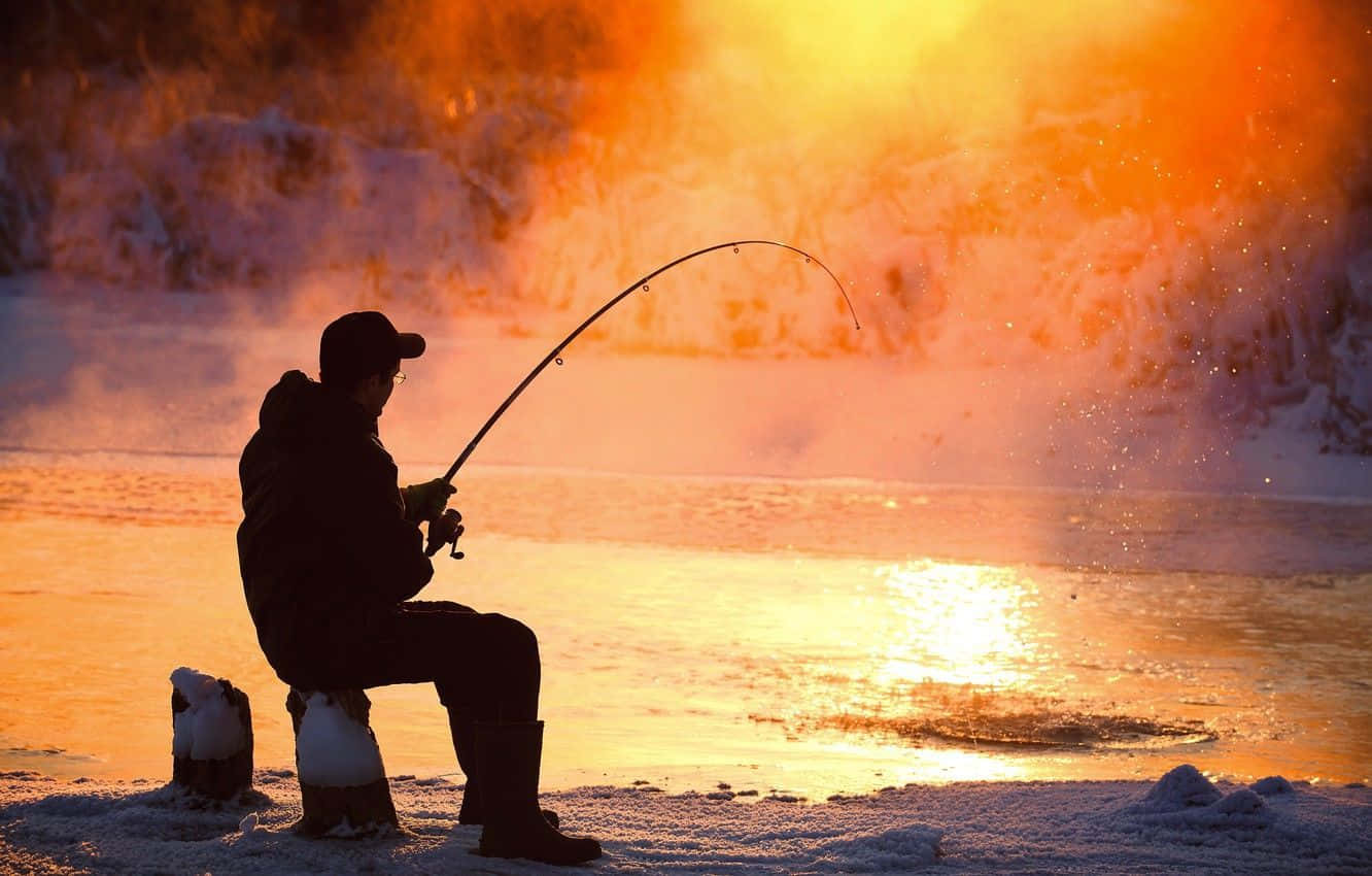 A Group Of Ice Fishermen Enjoying A Day On A Frozen Lake. Wallpaper