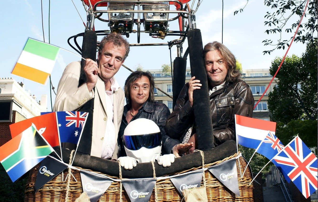 A Group Of Men In A Basket With Flags And Flags Wallpaper