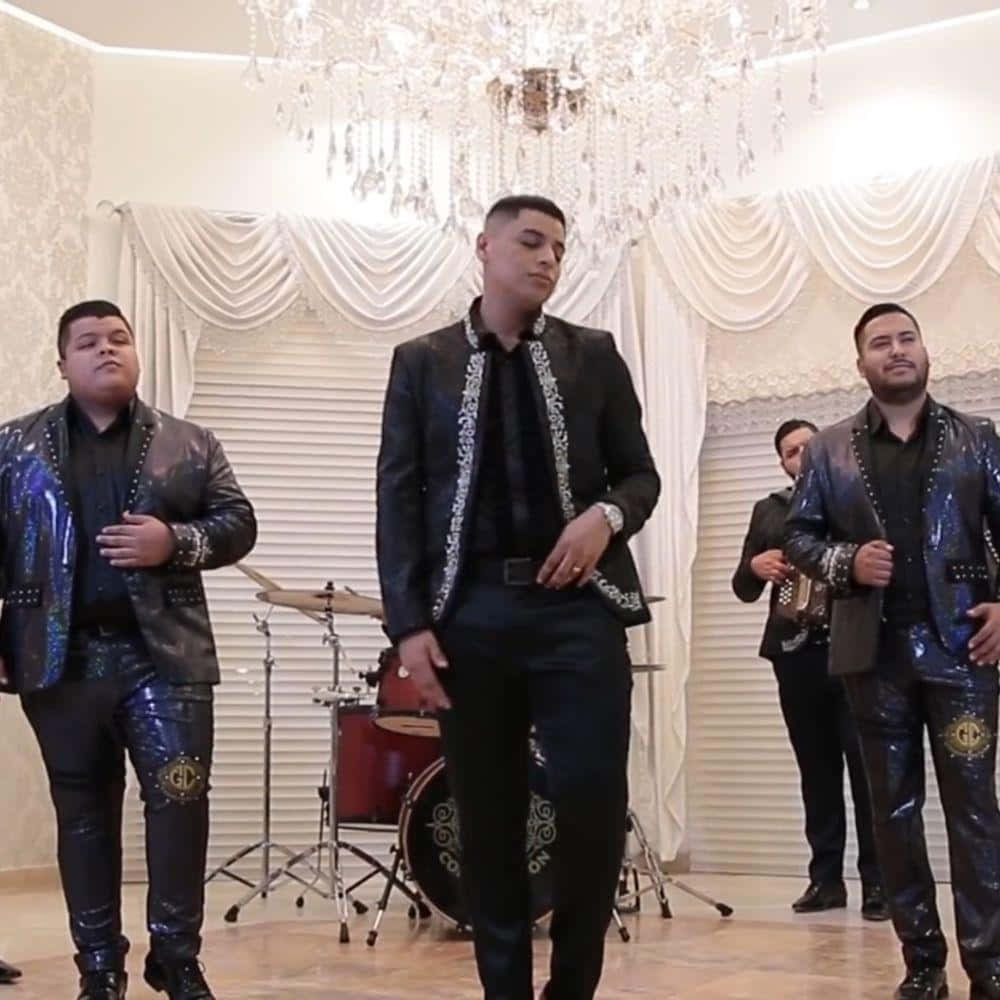 A Group Of Men In Suits Standing In A Room Wallpaper