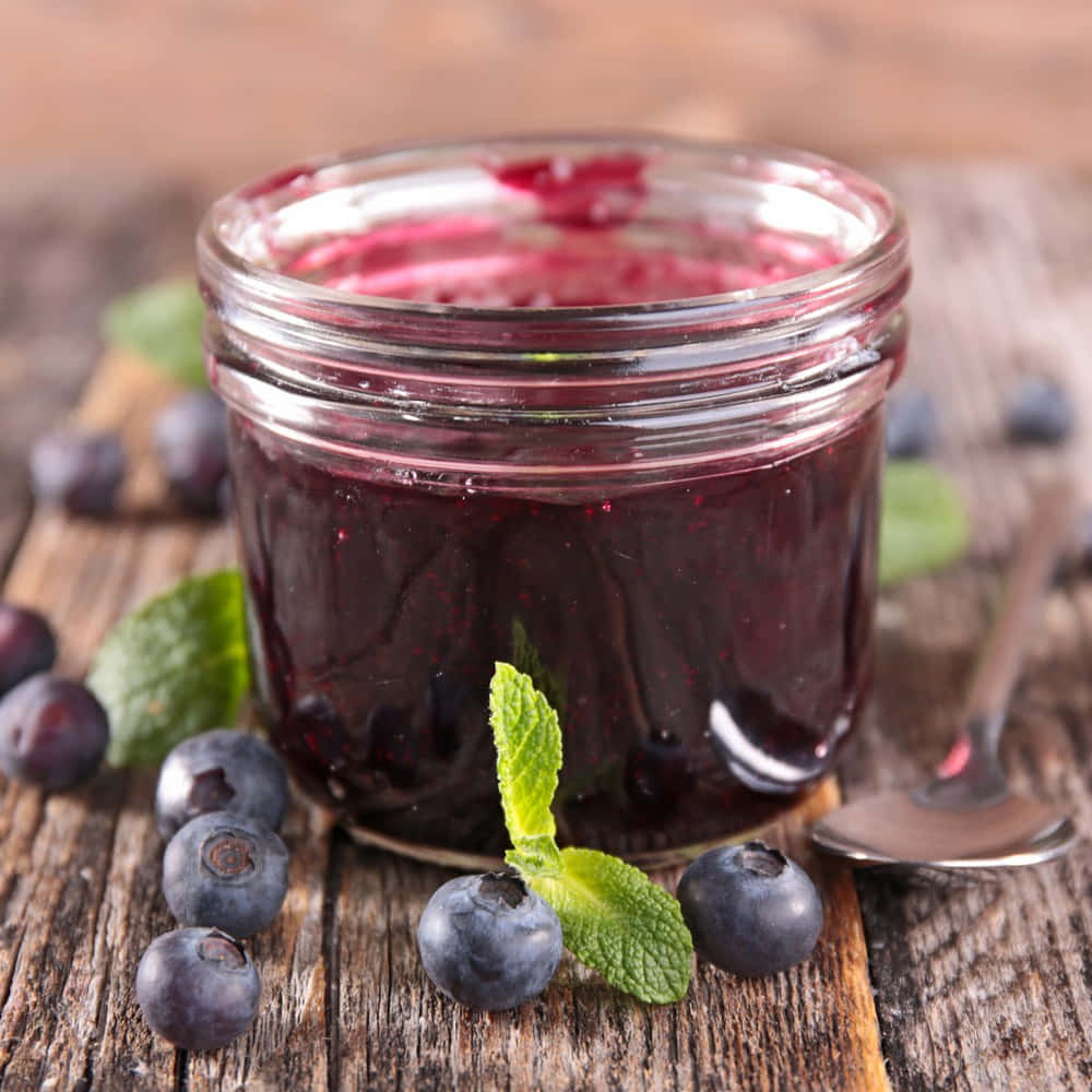 A Homemade Jar Of Blueberry Jam Wallpaper