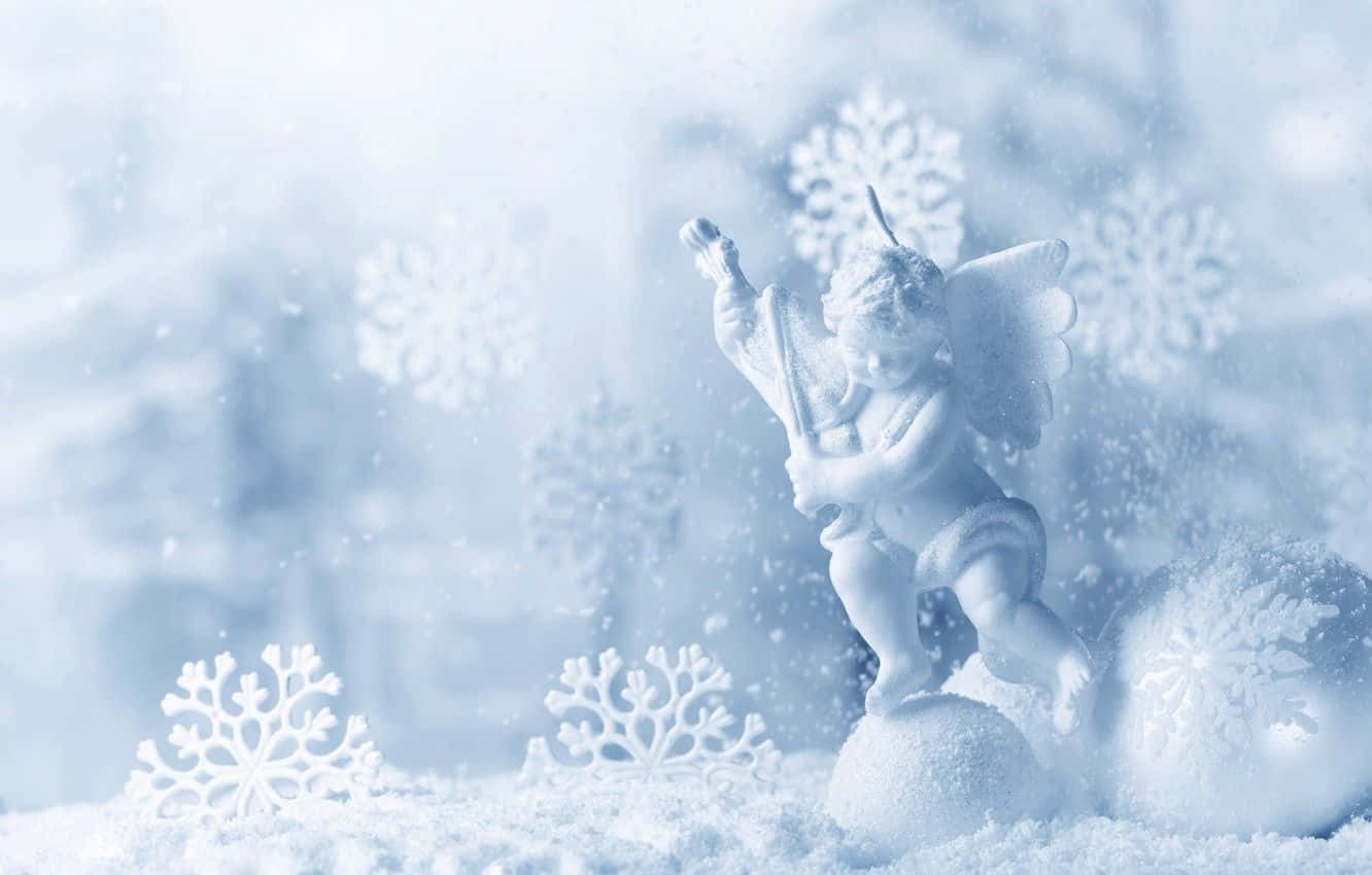 A Joyful Child Creating A Beautiful Snow Angel. Wallpaper