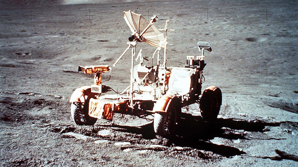 A Lunar Rover Exploring The Moon's Surface Wallpaper