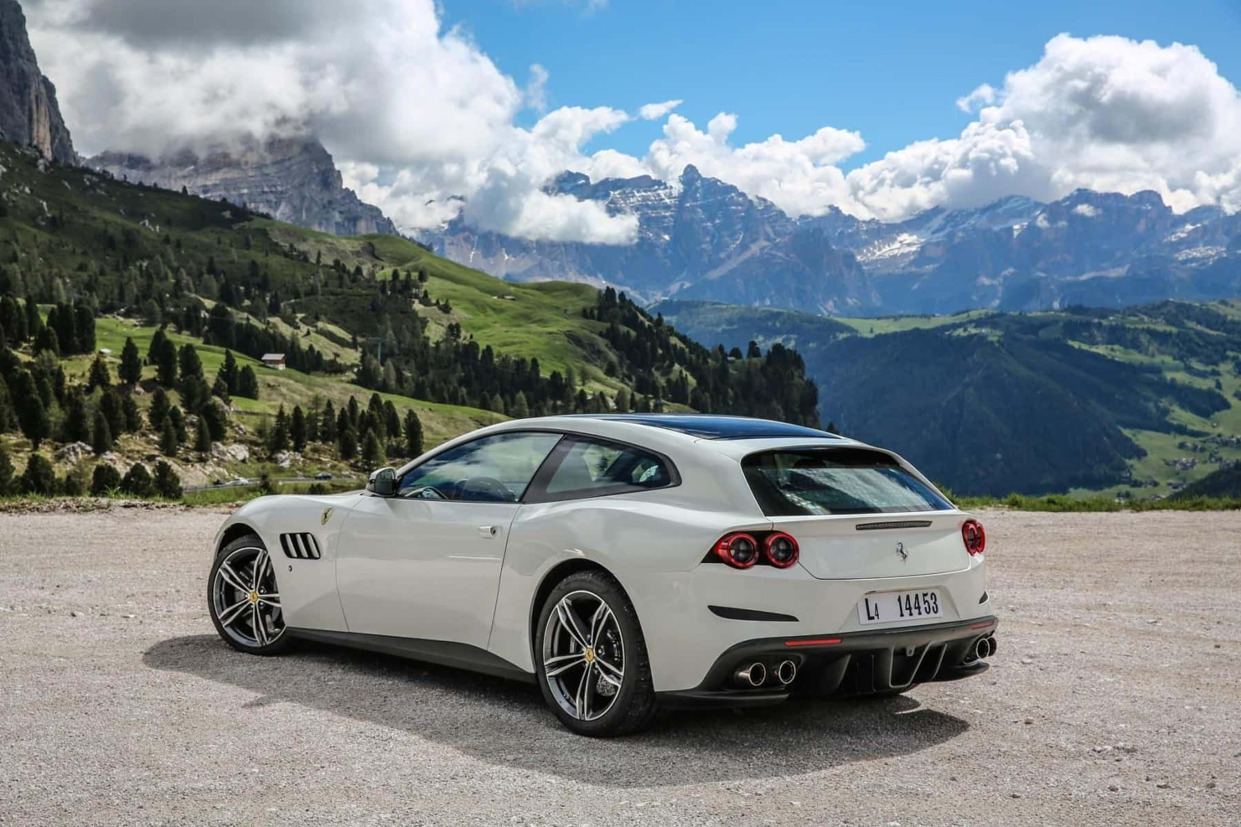 A Luxurious Red Ferrari Gtc4lusso Amidst A Captivating Scenic Backdrop Wallpaper