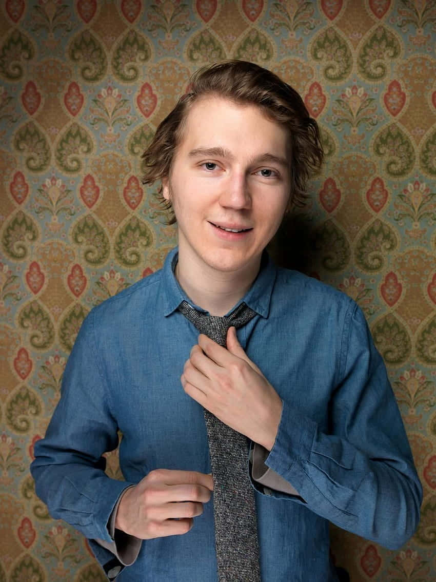 A Man Is Posing With His Tie Wallpaper