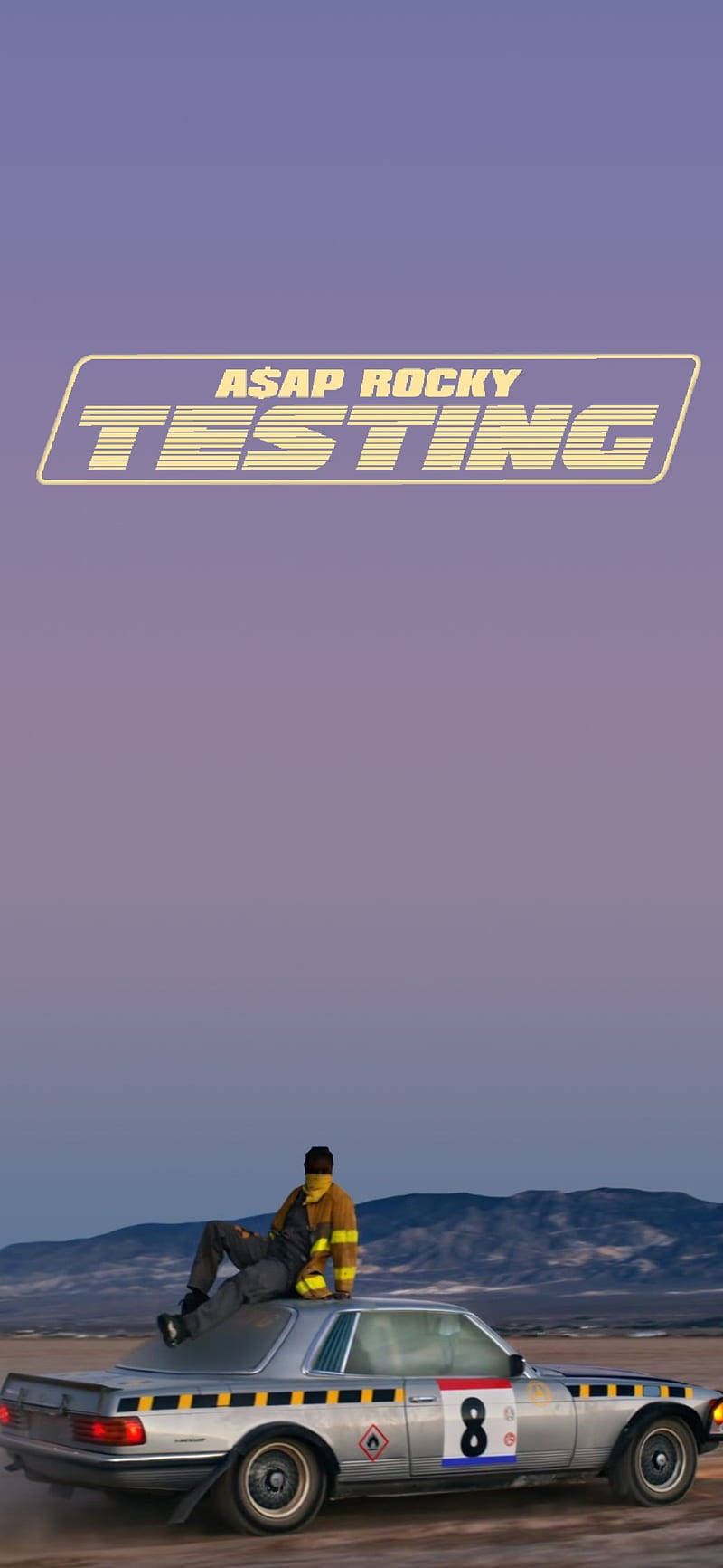 A Man Is Sitting On Top Of A Car With The Words Testing Wallpaper