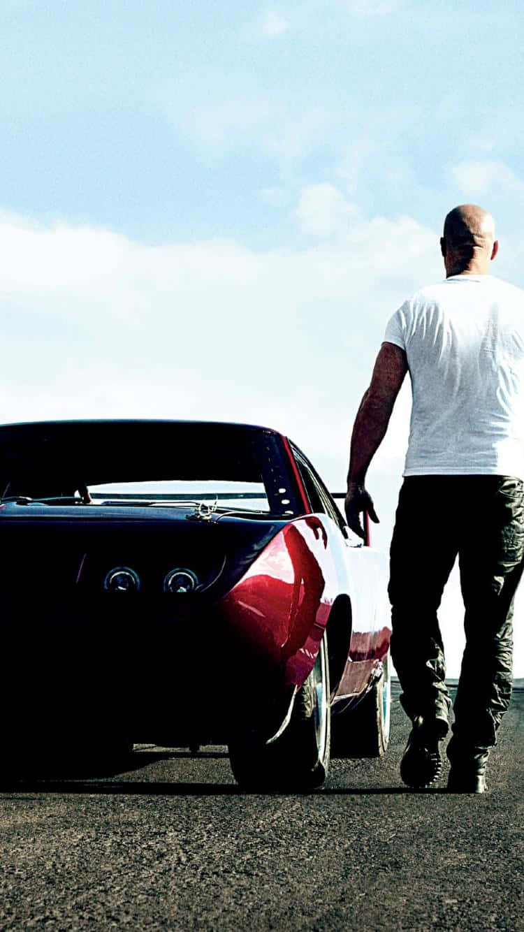 A Man Is Standing Next To A Red Car Wallpaper