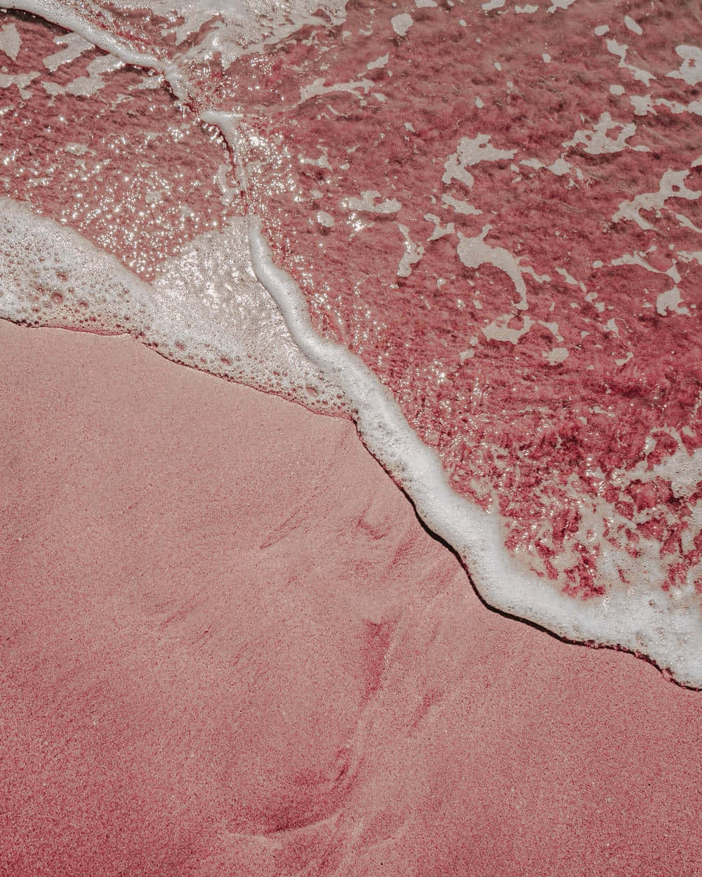 A Man Is Standing On A Beach Wallpaper