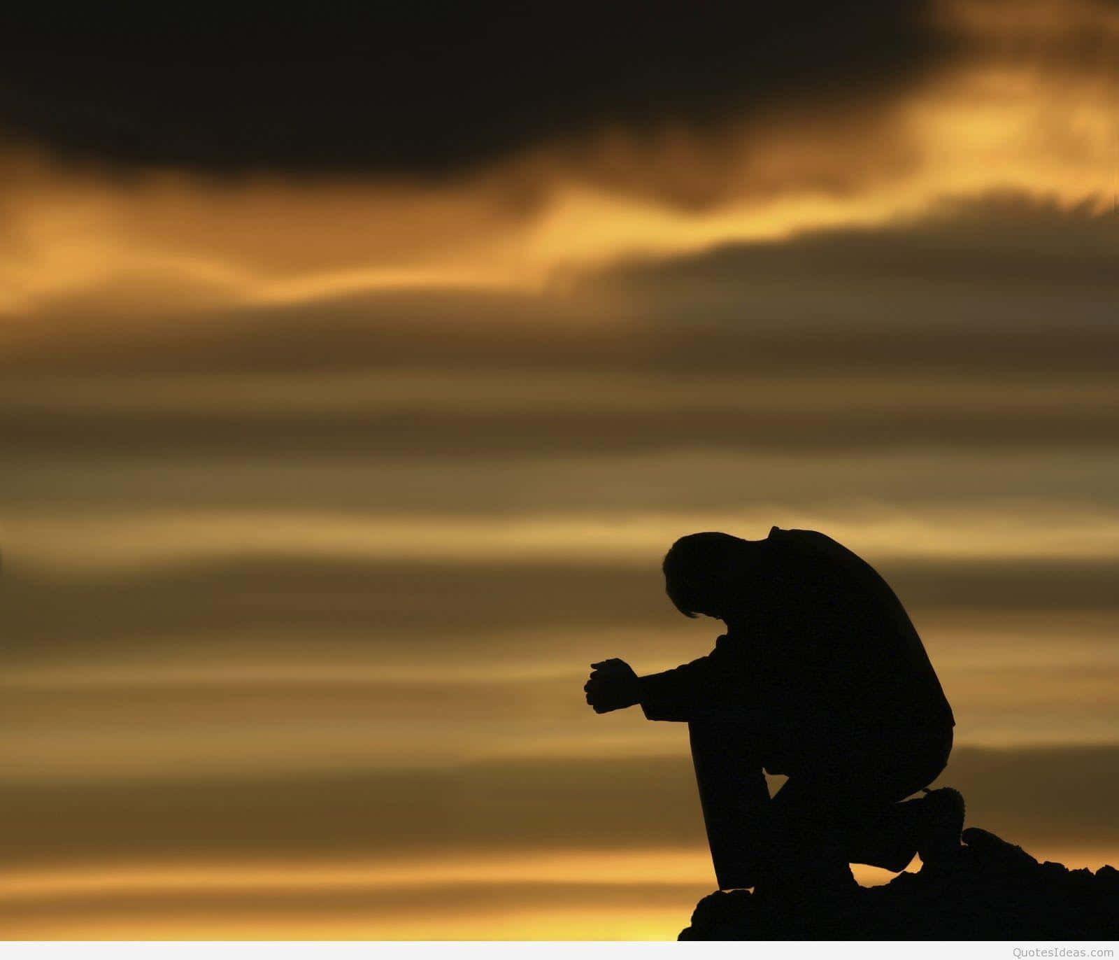 A Man Kneeling Down Wallpaper