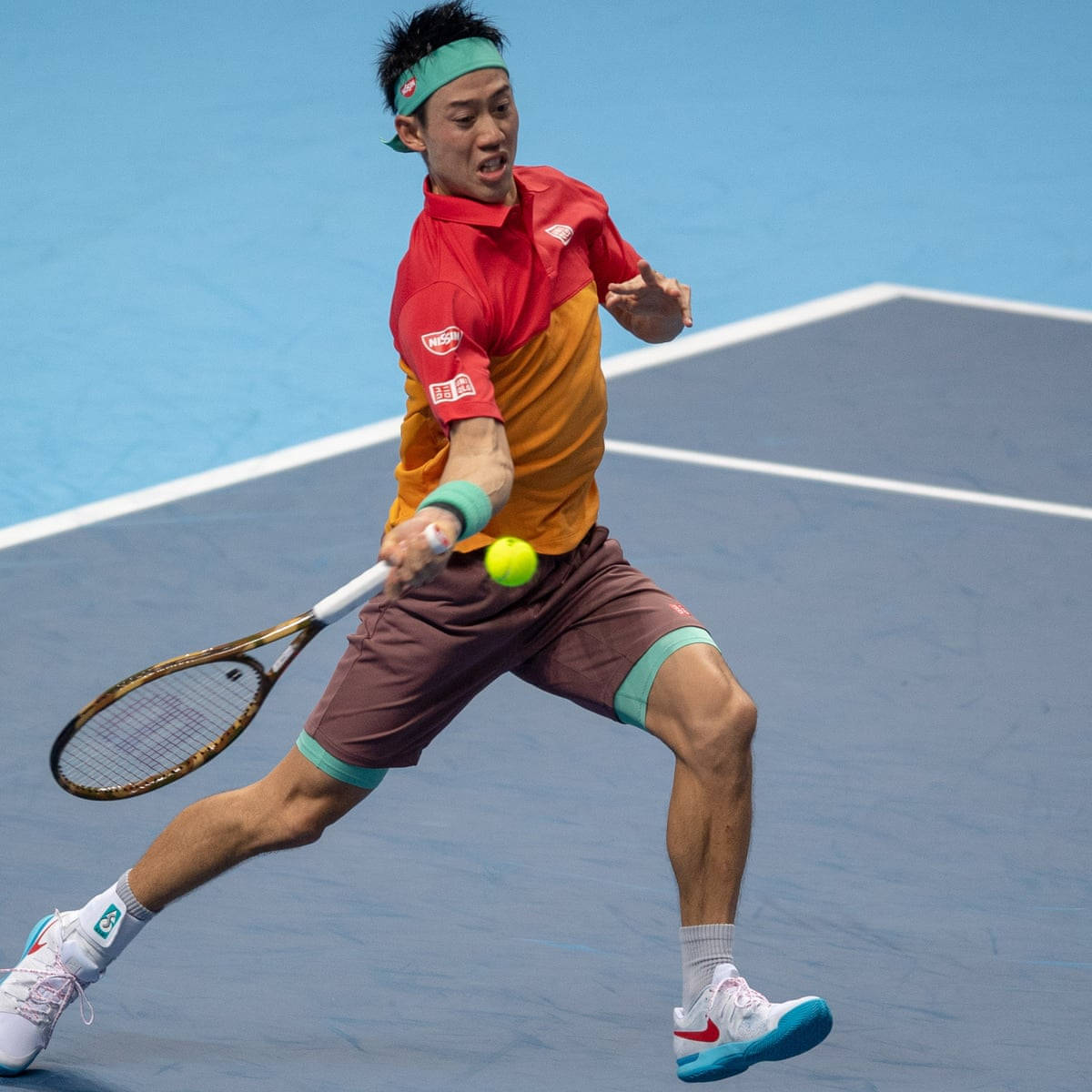 A Man Playing Tennis On A Court Wallpaper