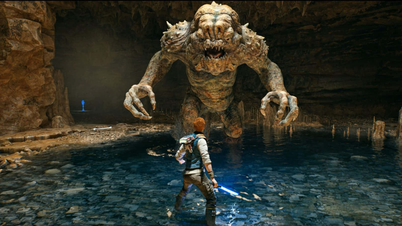 A Menacing Rancor Lurks In A Shadowy Cave. Wallpaper