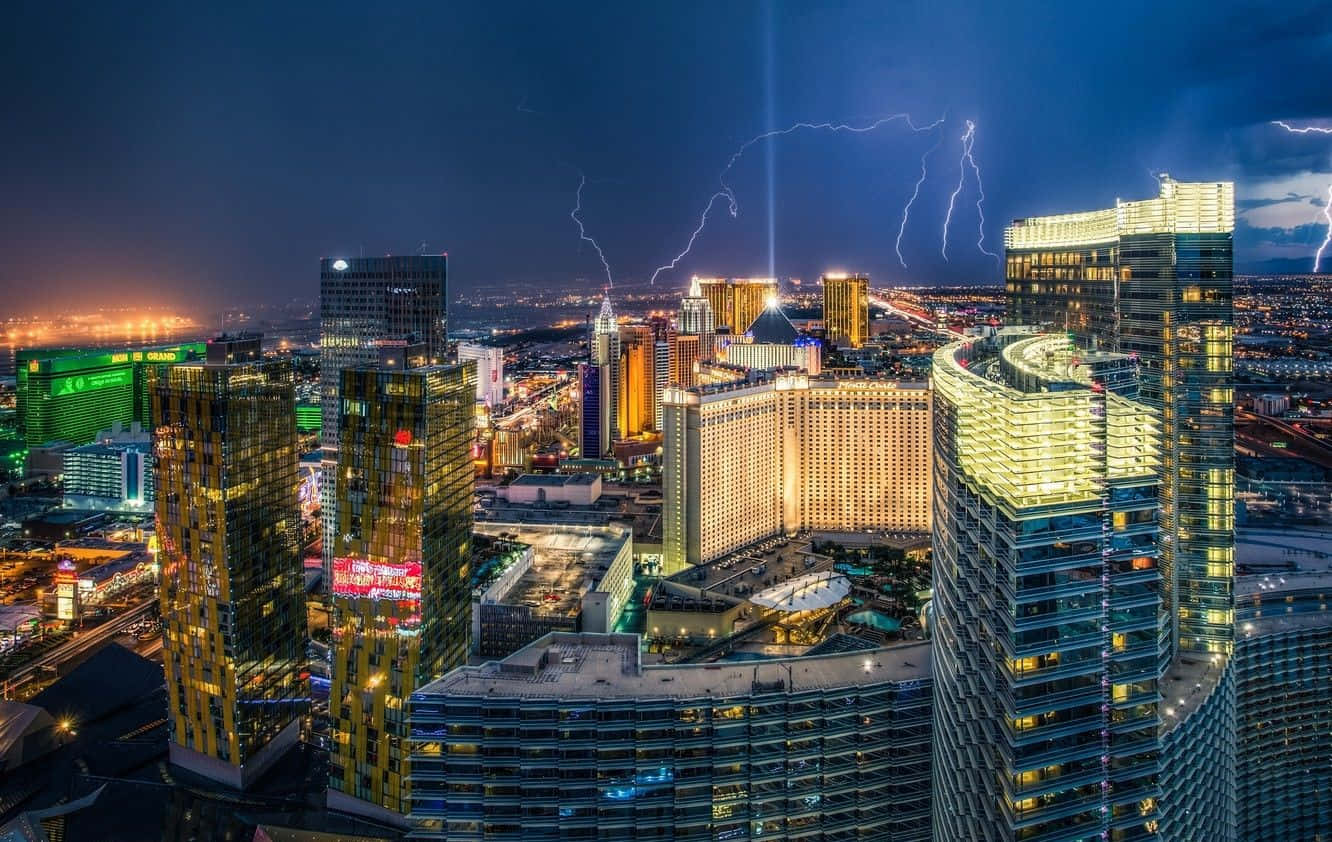 A Mesmerizing Night's Sky With The Skyline Of Las Vegas In The Background Wallpaper