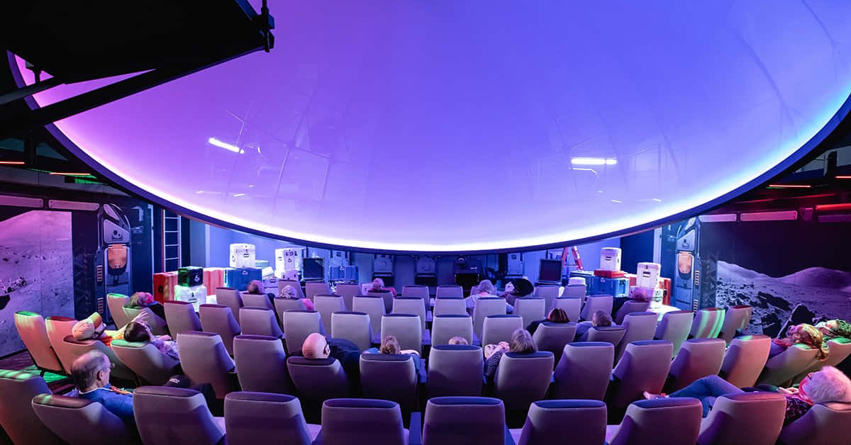 A Mesmerizing Night Sky Inside A Planetarium Wallpaper