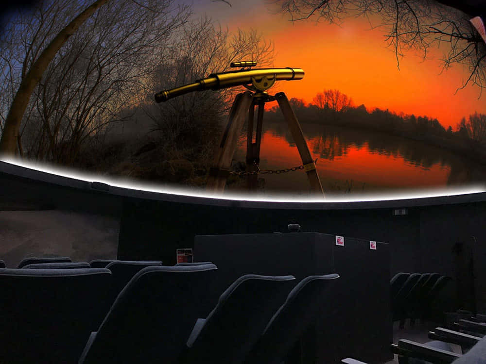 A Mesmerizing View Inside A Planetarium Wallpaper